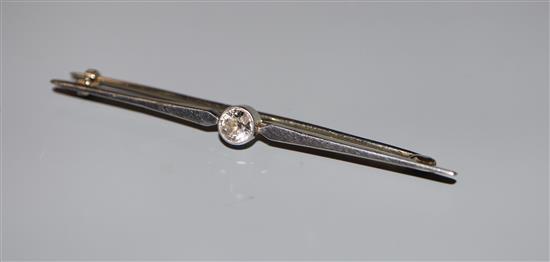 A white metal and solitaire diamond set bar brooch, 56mm, gross 3.3 grams.